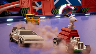 Three hot wheels cars race on a track. One features Snoopy sitting on top of his doghouse. The others are a grey coupe and a yellow minibus. 